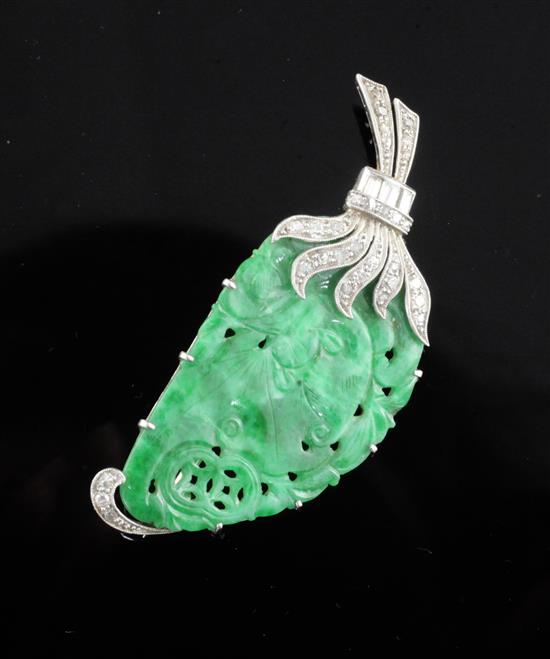 A white gold mounted carved jadeite and diamond gourd brooch, 48mm.